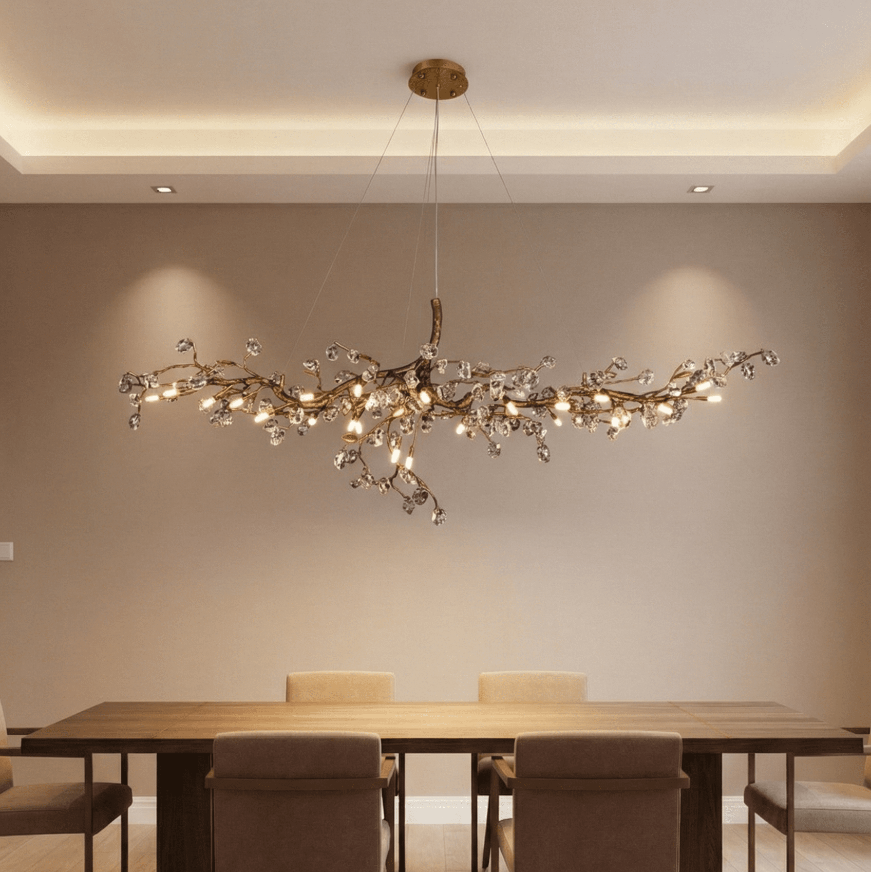 Contemporary branch chandelier with crystal accents centered above a modern dining table, creating warm ambient lighting in a luxury dining room interior